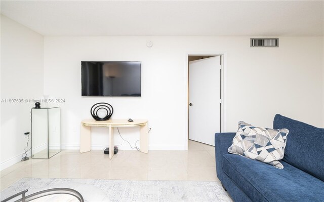 living room featuring light tile floors