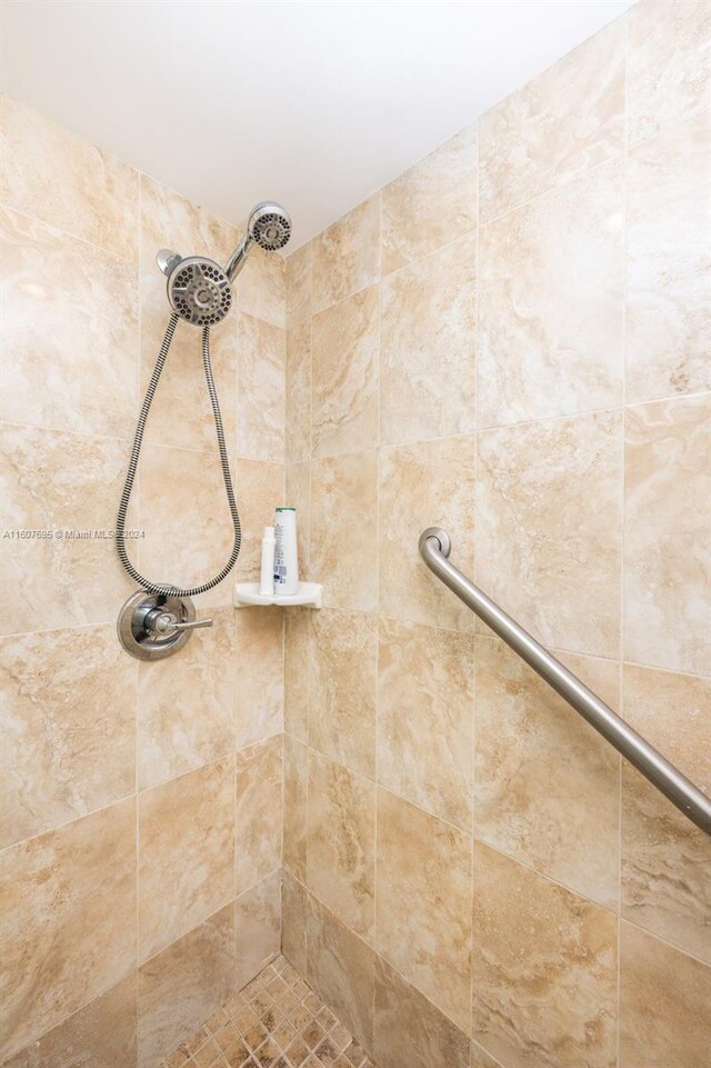 bathroom with tiled shower