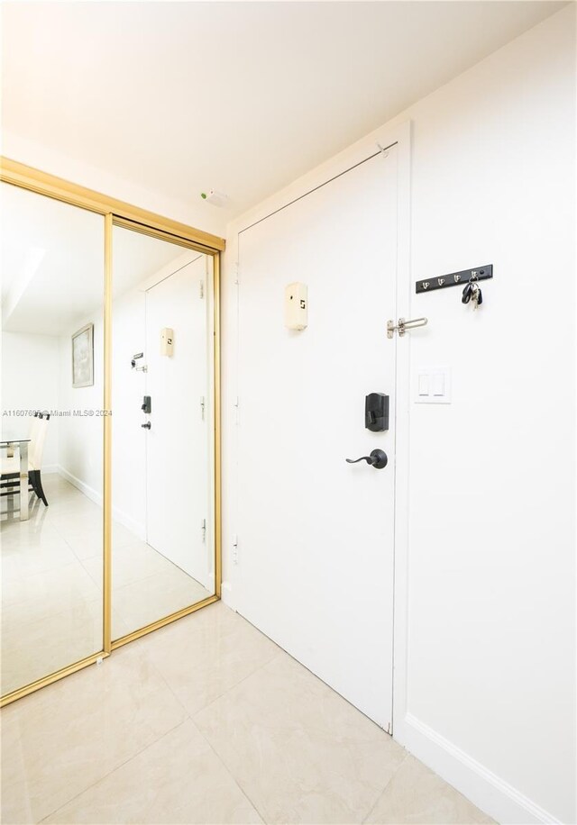 doorway featuring light tile floors