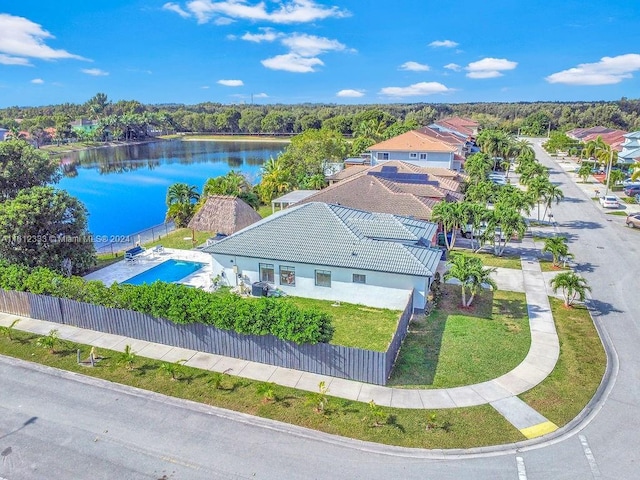 birds eye view of property with a water view