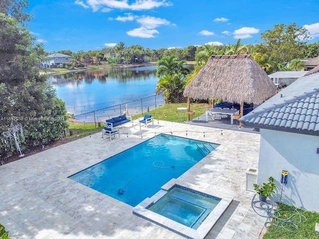 view of swimming pool with a gazebo, a patio area, an in ground hot tub, and a water view