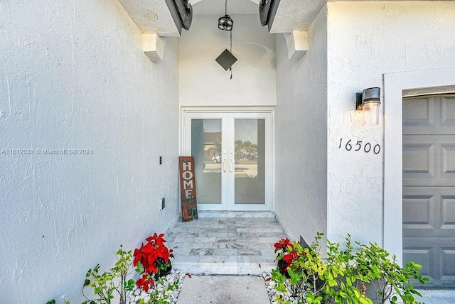 view of exterior entry featuring french doors