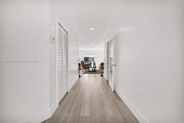 hallway with light wood-type flooring