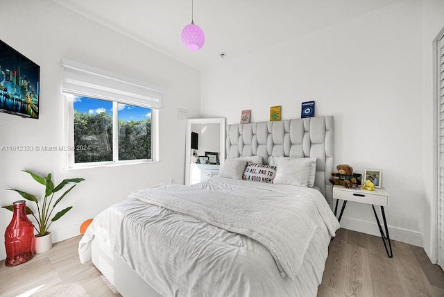 bedroom with light hardwood / wood-style flooring