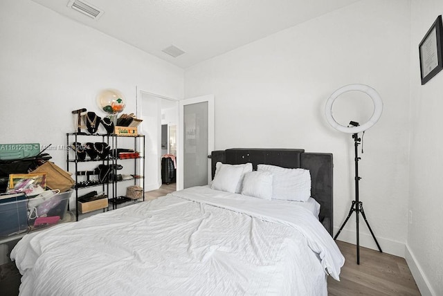 bedroom featuring hardwood / wood-style flooring