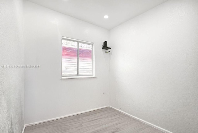 empty room with hardwood / wood-style floors