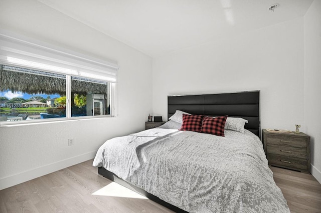 bedroom with light hardwood / wood-style floors