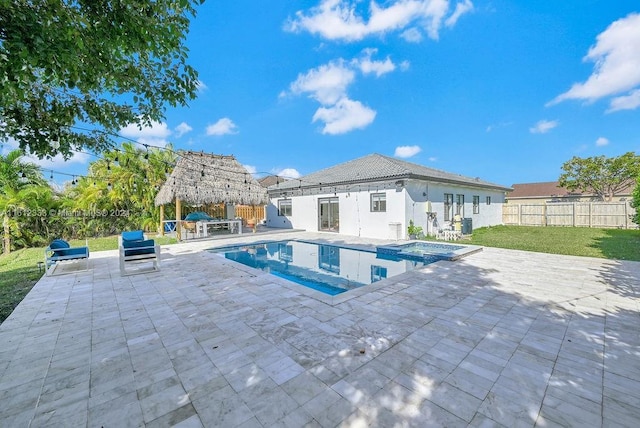 view of pool featuring a patio area and a yard