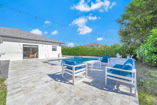 view of patio / terrace with a fenced in pool