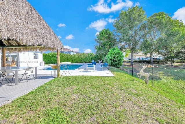 view of yard with a swimming pool side deck