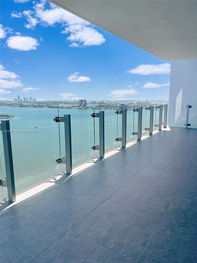 balcony featuring a water view