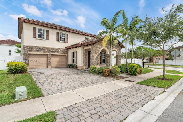 mediterranean / spanish-style home featuring a garage