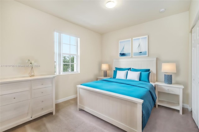 bedroom featuring light carpet