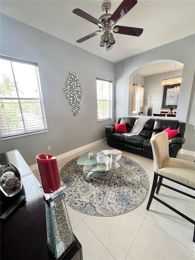 living room with ceiling fan and tile floors