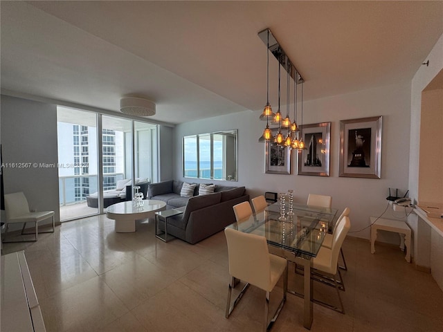 tiled dining room with floor to ceiling windows and an inviting chandelier