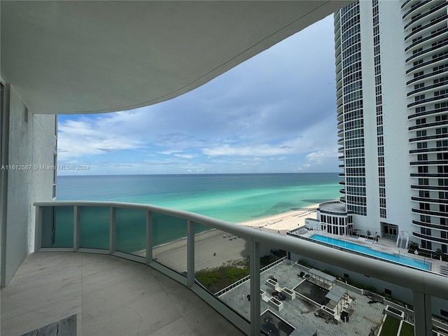 balcony featuring a water view and central air condition unit