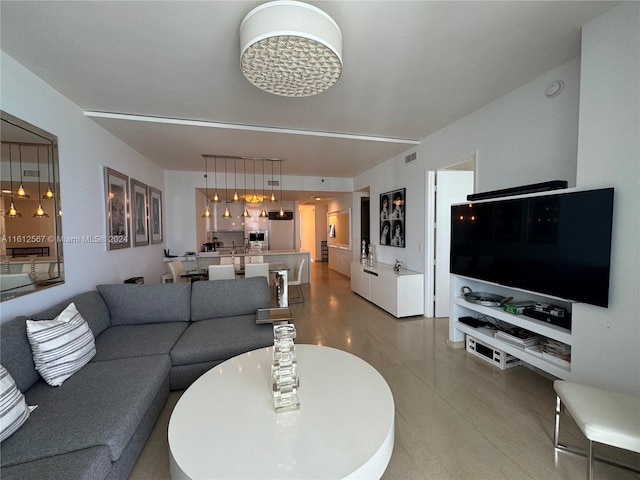 living room featuring visible vents