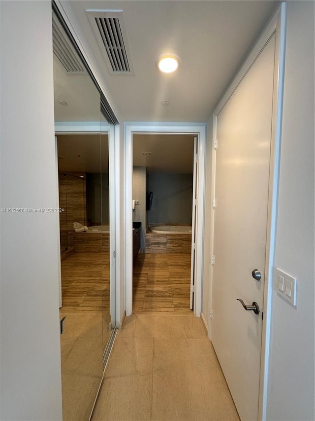 hallway featuring light hardwood / wood-style flooring