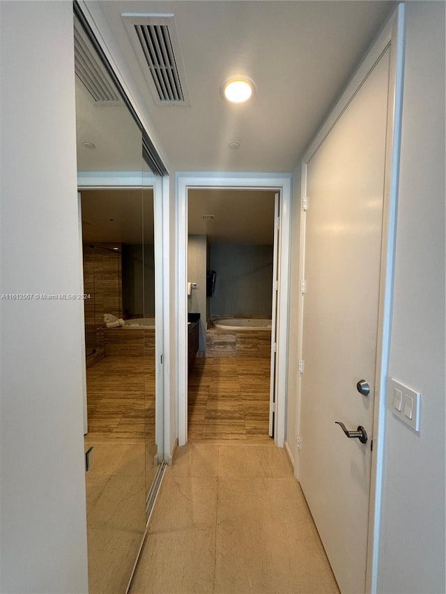hallway featuring visible vents