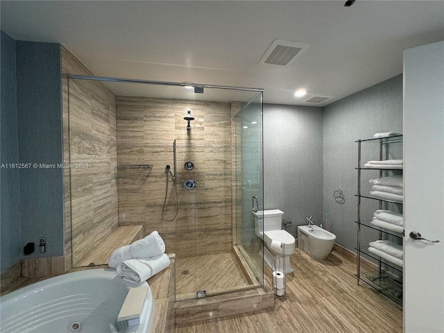 full bath featuring a bidet, visible vents, a stall shower, a tub with jets, and wood finished floors