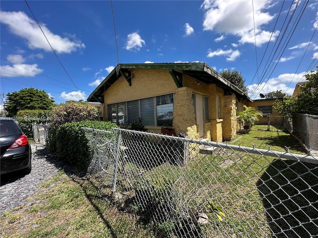 view of home's exterior featuring a yard