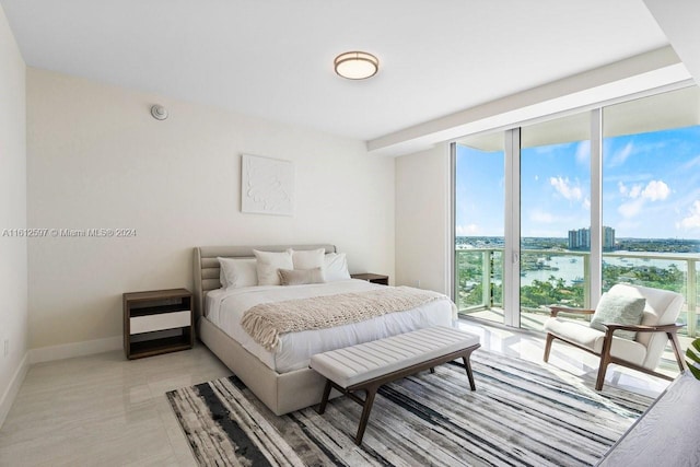 tiled bedroom with a water view