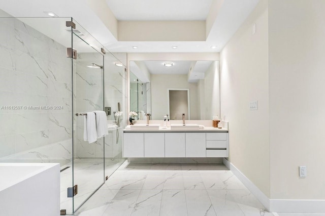 bathroom featuring vanity and a shower with door