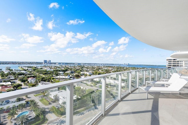 balcony featuring a water view