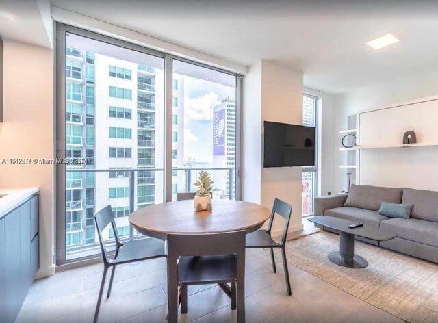 dining space with floor to ceiling windows