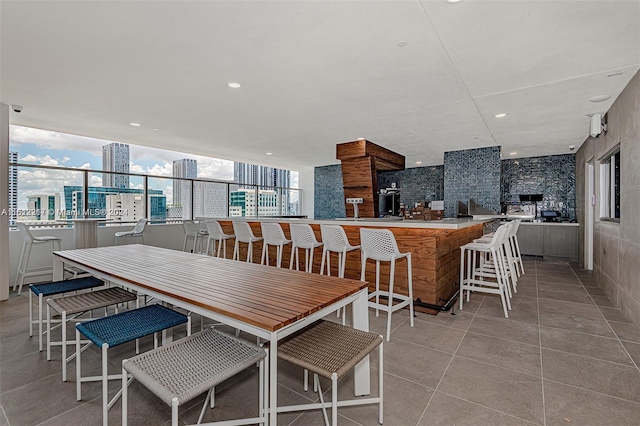 dining room with light tile patterned flooring