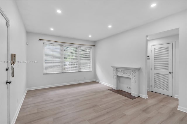 unfurnished living room featuring light wood-type flooring