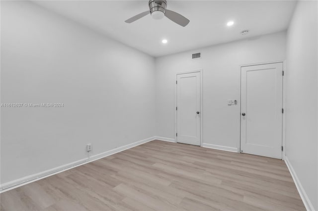 unfurnished room with ceiling fan and light hardwood / wood-style floors