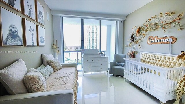 bedroom with a wall of windows and a crib