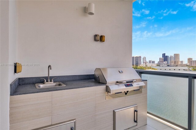 view of patio with sink and grilling area