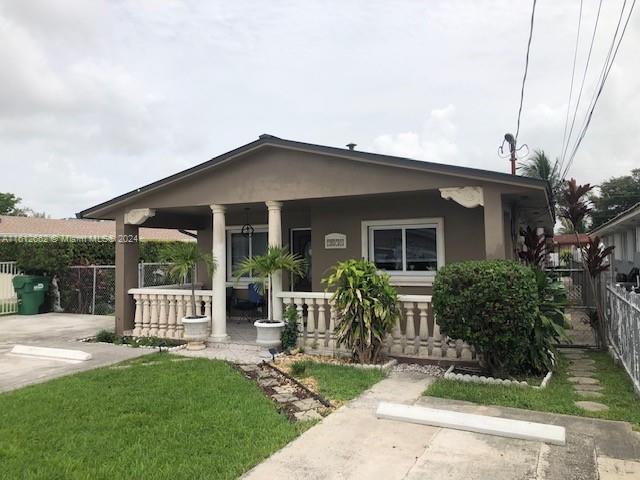 back of house with a porch