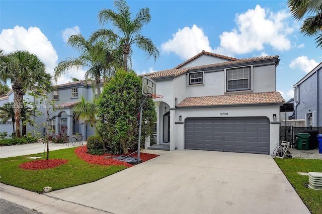 mediterranean / spanish house featuring a garage