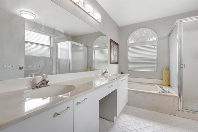 bathroom featuring shower with separate bathtub, oversized vanity, and dual sinks