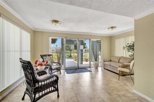 living room featuring ornamental molding, a textured ceiling, and light tile floors