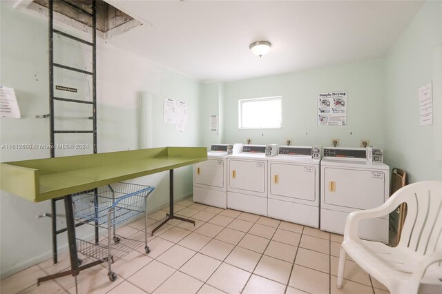 washroom with washer and dryer, light tile flooring, and hookup for an electric dryer