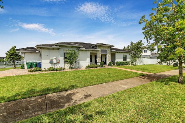 prairie-style house with a front lawn