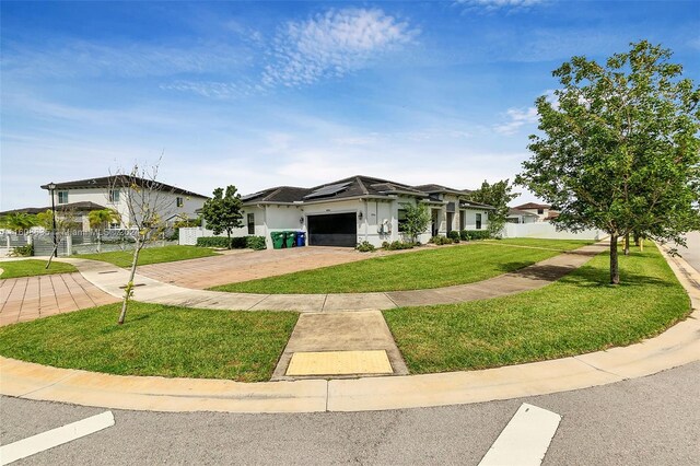 ranch-style house with a front lawn and a garage