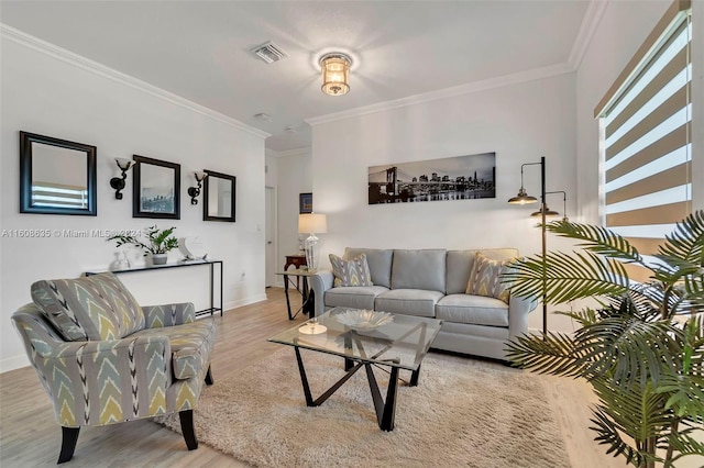 living room with ornamental molding and wood-type flooring