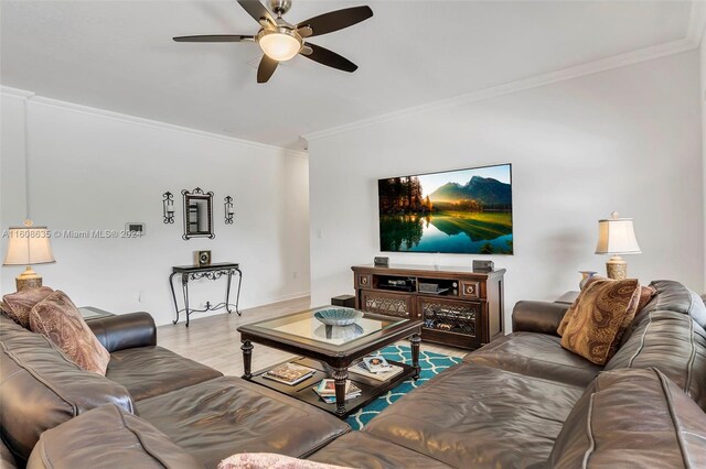 living room with crown molding, ceiling fan, and hardwood / wood-style floors