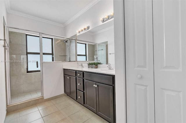 bathroom featuring double vanity, ornamental molding, a sink, a shower stall, and a closet