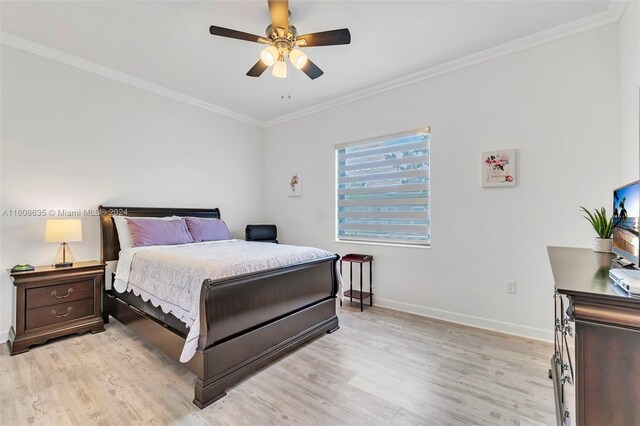 bedroom with ornamental molding, ceiling fan, and light hardwood / wood-style flooring