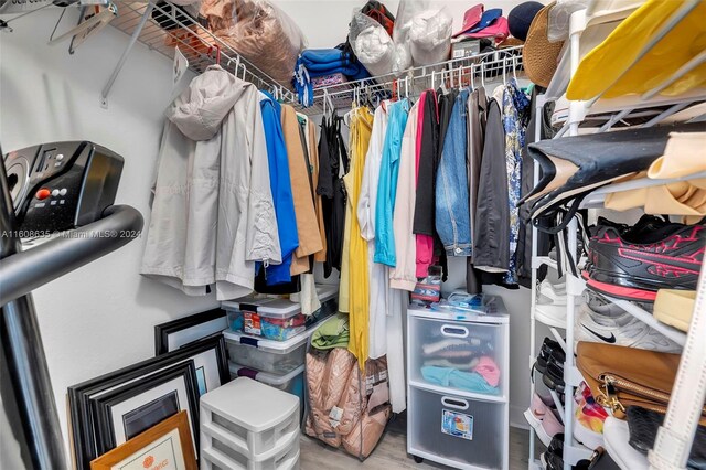 walk in closet featuring hardwood / wood-style flooring