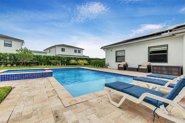 view of swimming pool with a patio area