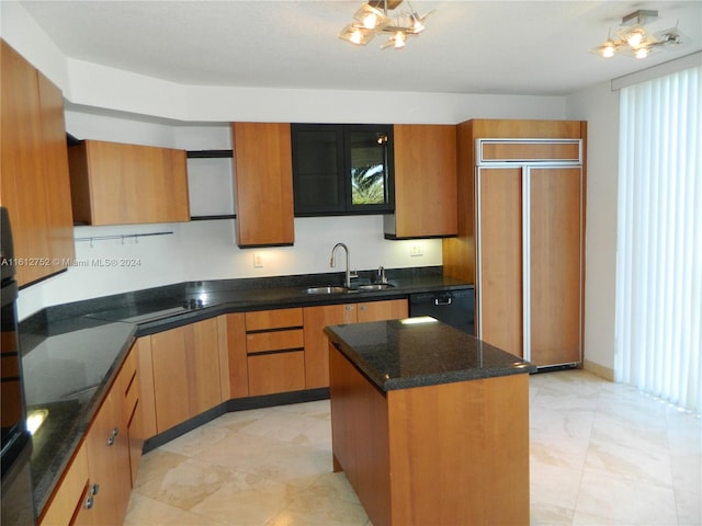 kitchen with a center island, sink, light tile patterned flooring, and black appliances