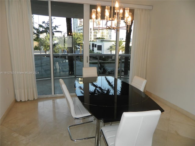 dining room featuring tile patterned flooring, expansive windows, and a notable chandelier