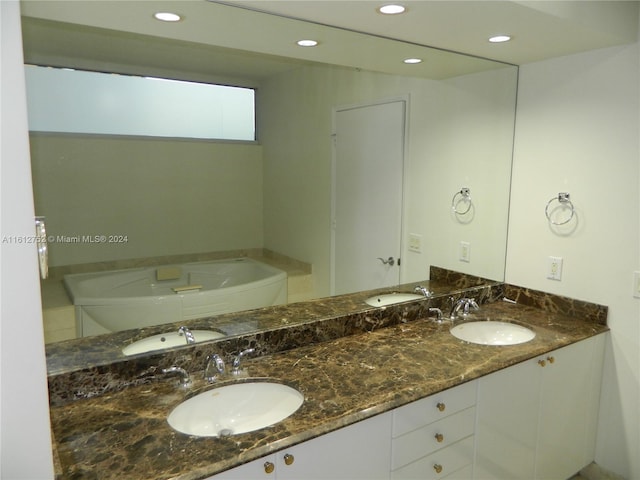 bathroom featuring a bathtub and vanity